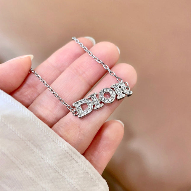 CD 26S PAVE LOGO LETTER BRACELET IN SILVER TONE METAL 631807