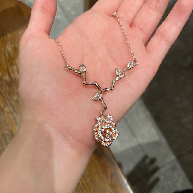 CD 26S CRYSTAL ROSE BRANCH PENDANT NECKLACE IN ROSE GOLD TONE METAL 631896