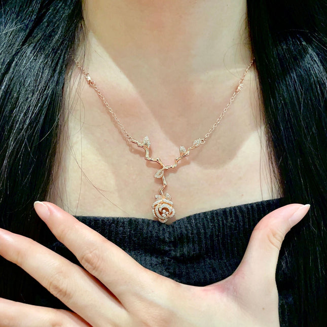 CD 26S CRYSTAL ROSE BRANCH PENDANT NECKLACE IN ROSE GOLD TONE METAL 631896