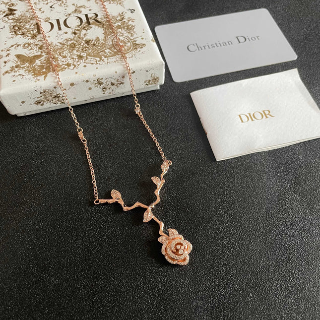 CD 26S CRYSTAL ROSE BRANCH PENDANT NECKLACE IN ROSE GOLD TONE METAL 631896
