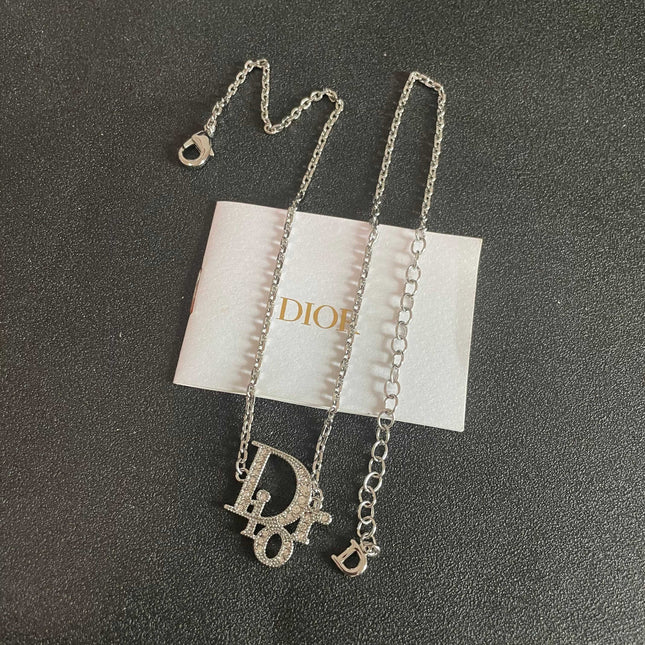 CD 26S CRYSTAL DIOR LOGO PENDANT NECKLACE IN SILVER METAL 631900