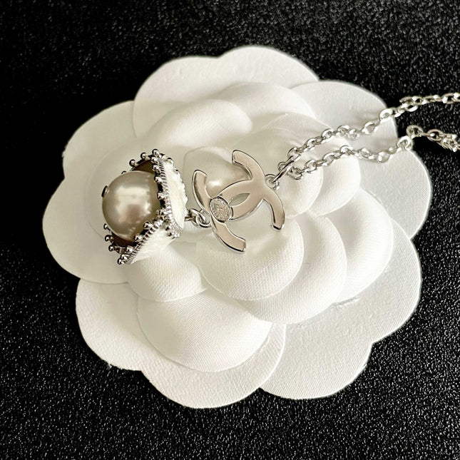 CHANEL 26S DOUBLE C LOGO PEARL DROP PENDANT NECKLACE WITH CRYSTAL HALO IN SILVER METAL 633293