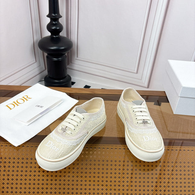 DIOR 26S LOW TOP SNEAKERS IN BEIGE CANVAS WITH WHITE LACE TRIM & LOGO PRINT