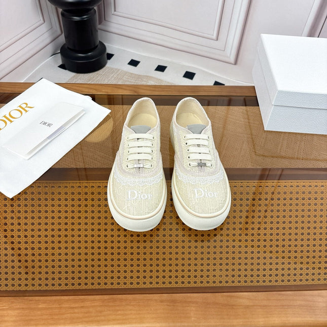 DIOR 26S LOW TOP SNEAKERS IN BEIGE CANVAS WITH WHITE LACE TRIM & LOGO PRINT