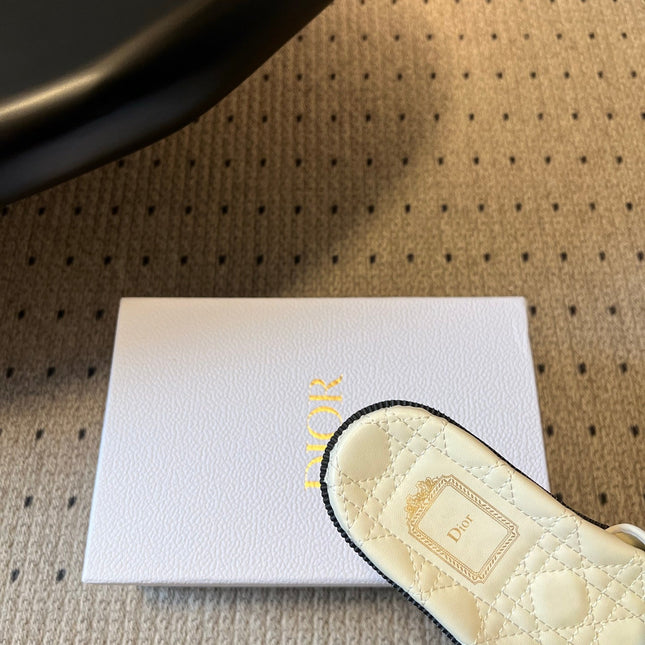 DIOR 26S SLIDES IN WHITE CALFSKIN WITH BOW