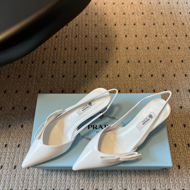 PRADA 26S BOW DETAIL SLINGBACK PUMPS 55MM IN WHITE PATENT CALFSKIN