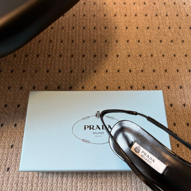 PRADA 26S BOW DETAIL SLINGBACK PUMPS 55MM IN BLACK PATENT CALFSKIN