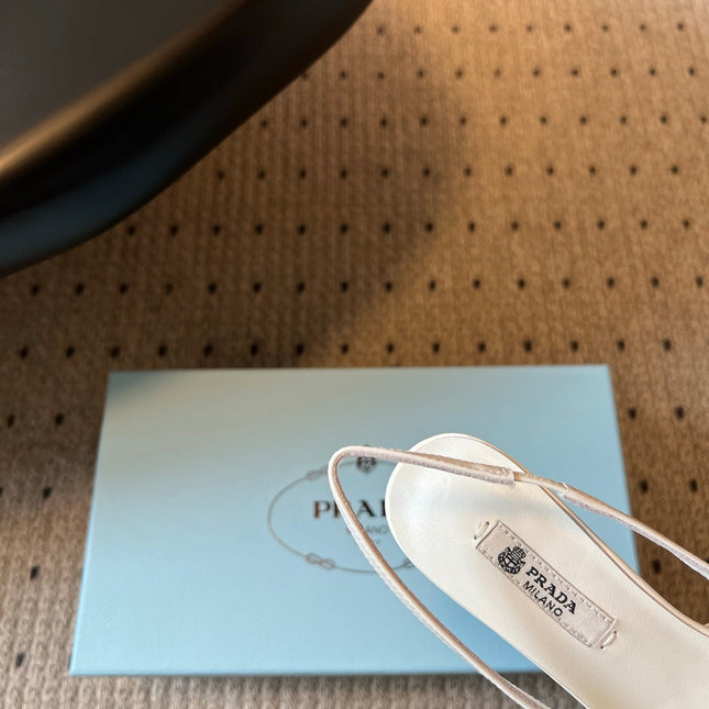 PRADA 26S BOW DETAIL SLINGBACK PUMPS 75MM IN WHITE PATENT CALFSKIN