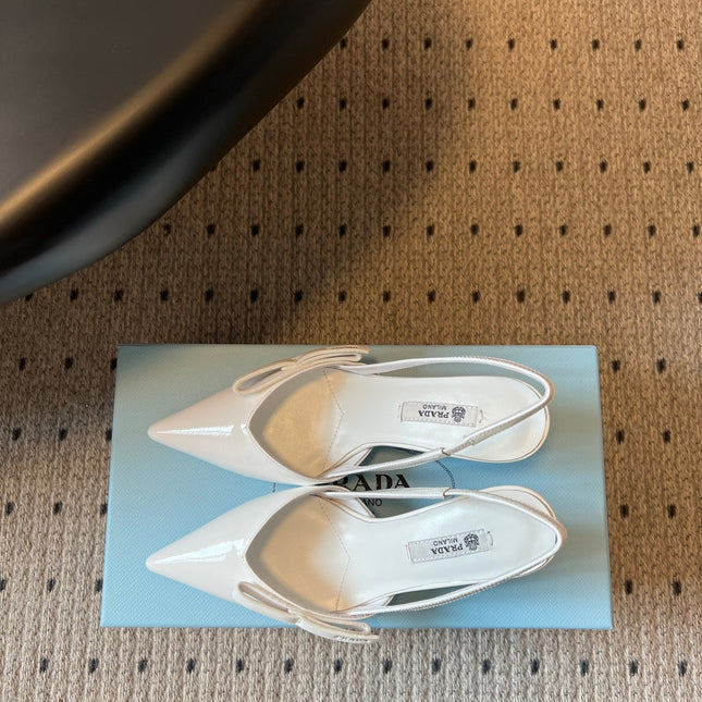 PRADA 26S BOW DETAIL SLINGBACK PUMPS 75MM IN WHITE PATENT CALFSKIN