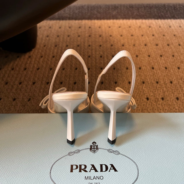 PRADA 26S BOW DETAIL SLINGBACK PUMPS 75MM IN WHITE PATENT CALFSKIN