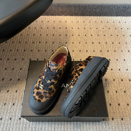 CHANEL 26S LACE UP SNEAKERS IN BLACK CALFSKIN AND BROWN PONY HAIR LEOPARD PRINT