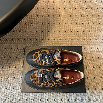CHANEL 26S LACE UP SNEAKERS IN BLACK CALFSKIN AND BROWN PONY HAIR LEOPARD PRINT