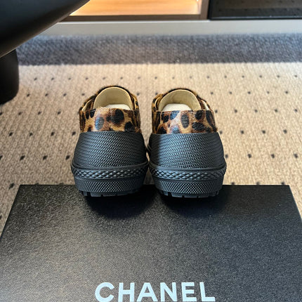 CHANEL 26S LACE UP SNEAKERS IN BLACK CALFSKIN AND BROWN PONY HAIR LEOPARD PRINT