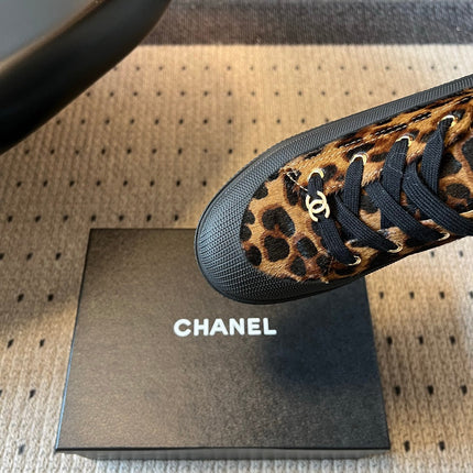 CHANEL 26S LACE UP SNEAKERS IN BLACK CALFSKIN AND BROWN PONY HAIR LEOPARD PRINT