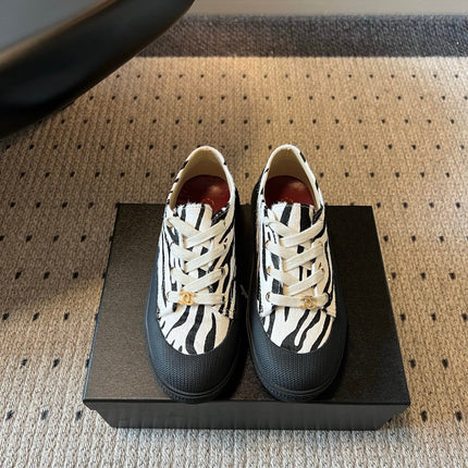 CHANEL 26S LACE UP SNEAKERS IN BLACK CALFSKIN AND WHITE PONY HAIR
