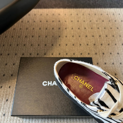 CHANEL 26S LACE UP SNEAKERS IN BLACK CALFSKIN AND WHITE PONY HAIR