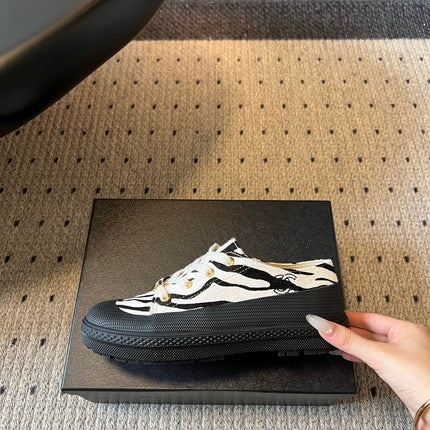 CHANEL 26S LACE UP SNEAKERS IN BLACK CALFSKIN AND WHITE PONY HAIR