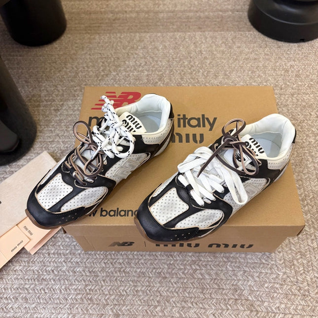 MIUMIU 26S PERFORATED SNEAKERS IN WHITE AND BLACK CALFSKIN