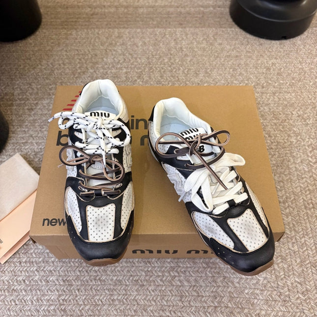 MIUMIU 26S PERFORATED SNEAKERS IN WHITE AND BLACK CALFSKIN