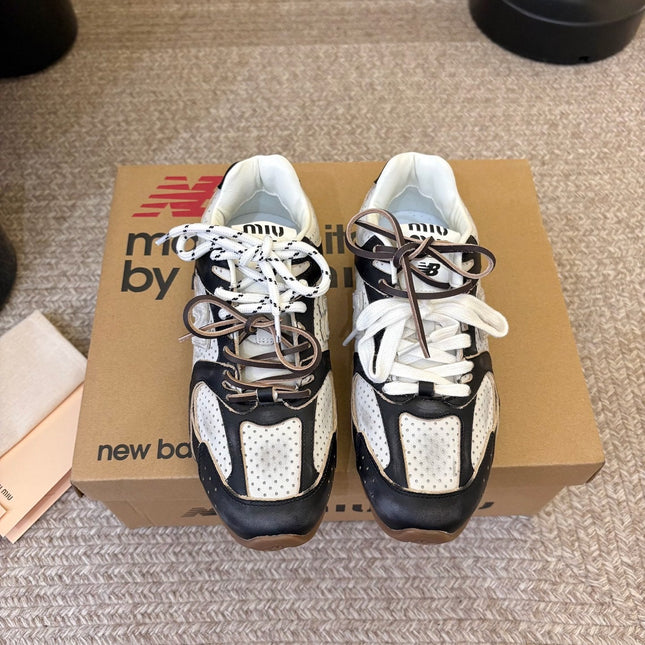 MIUMIU 26S PERFORATED SNEAKERS IN WHITE AND BLACK CALFSKIN