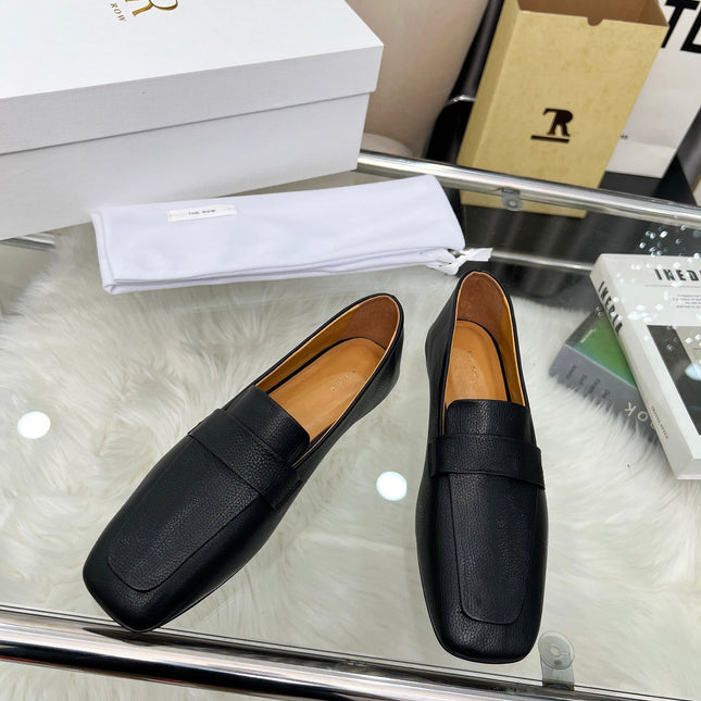 THE ROW 26S PENNY LOAFER FLATS IN BLACK GRAINED CALFSKIN