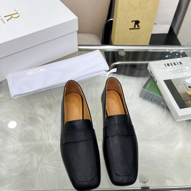 THE ROW 26S PENNY LOAFER FLATS IN BLACK GRAINED CALFSKIN