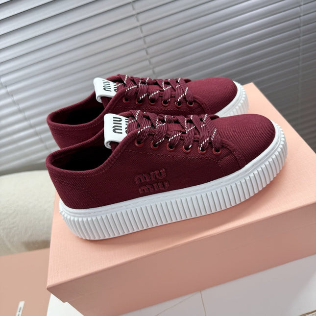 MIUMIU 26S PLATFORM SNEAKERS IN DARK RED CANVAS