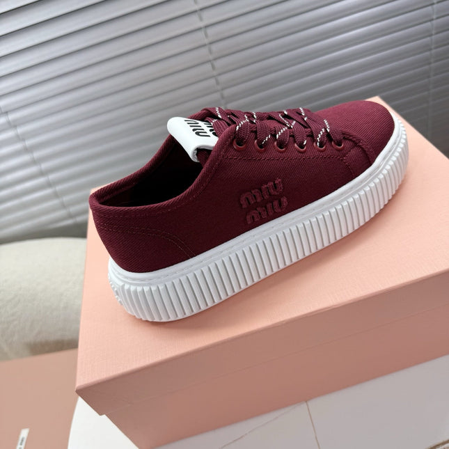 MIUMIU 26S PLATFORM SNEAKERS IN DARK RED CANVAS