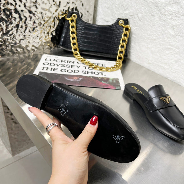 PRADA 26S MULE LOAFERS IN BLACK CALFSKIN WITH LOGO