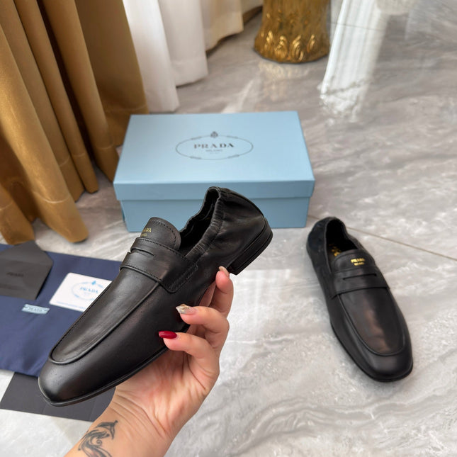 PRADA 25S LOAFERS IN BLACK CALFSKIN