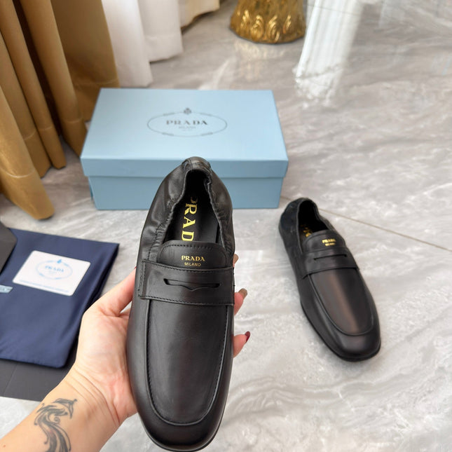 PRADA 25S LOAFERS IN BLACK CALFSKIN