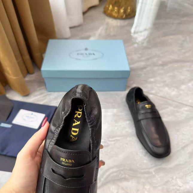 PRADA 25S LOAFERS IN BLACK CALFSKIN