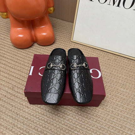 GUCCI 26S FLAT MULES IN BLACK GG EMBOSSED LAMBSKIN
