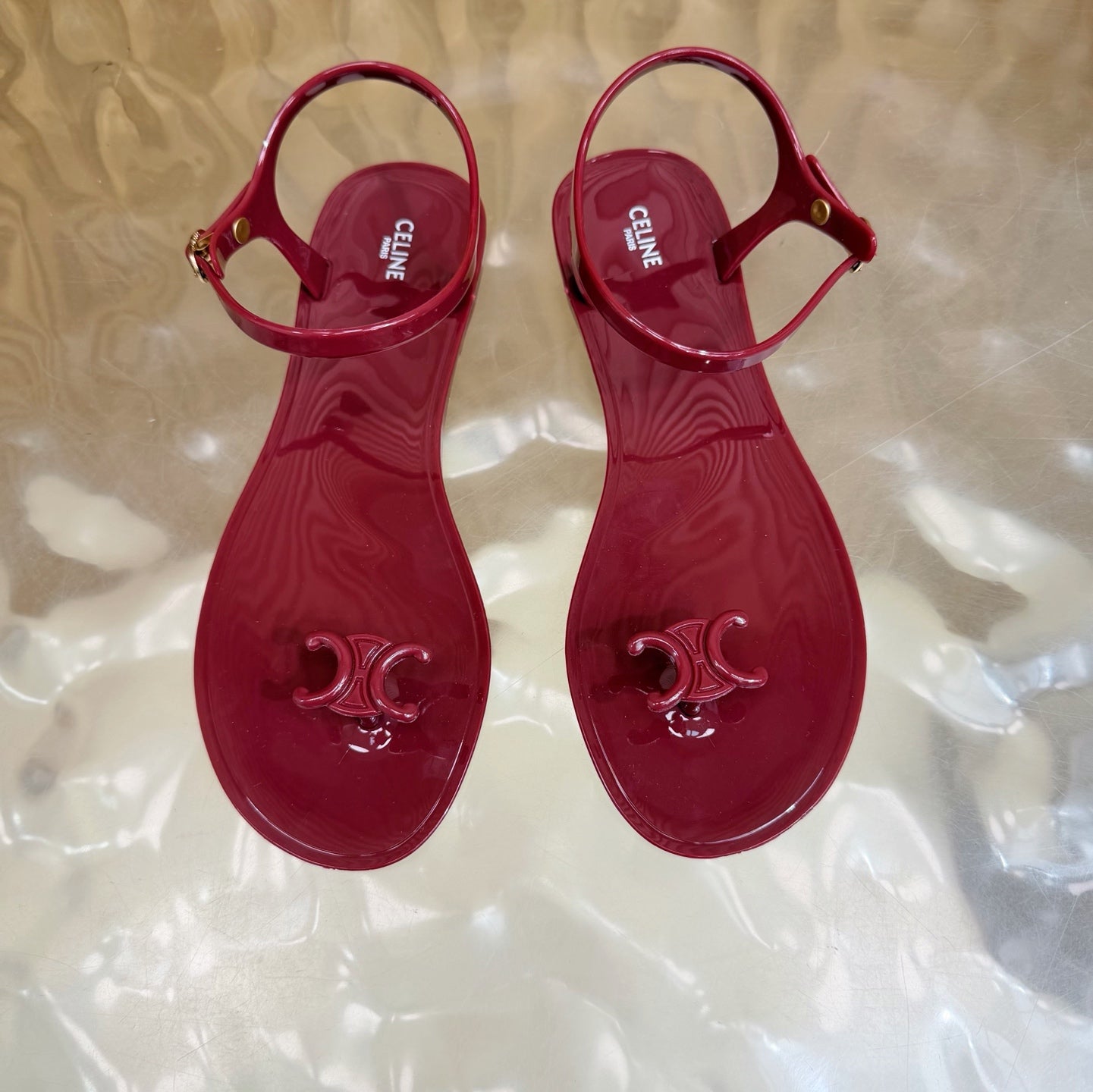 CELINE 26S TRIOMPHE JELLY THONG SANDALS IN BURGUNDY RED TPU GOLD HARDWARE