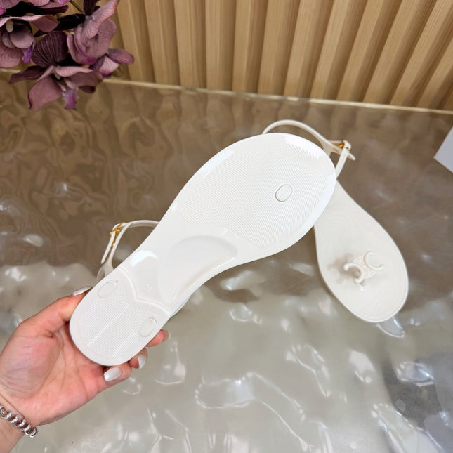 CELINE 26S TRIOMPHE JELLY THONG SANDALS IN WHITE TPU GOLD HARDWARE