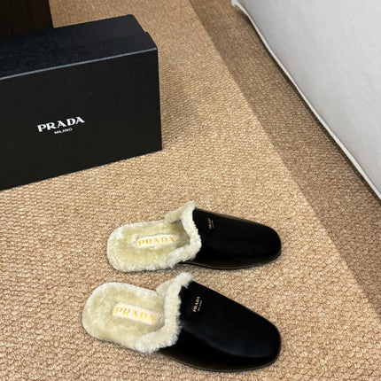 PRADA 26S SHEARLING MULE SLIPPERS IN BLACK CALFSKIN