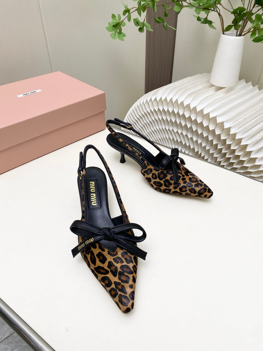 MIUMIU 26S SLINGBACK PUMPS 55MM IN LEOPARD PRINT CALF HAIR WITH BOW