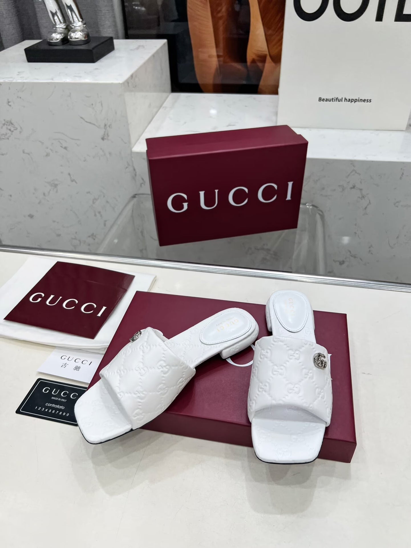 GG CASUAL SLIPPERS IN WHITE CALFSKIN LOGO EMBOSSING