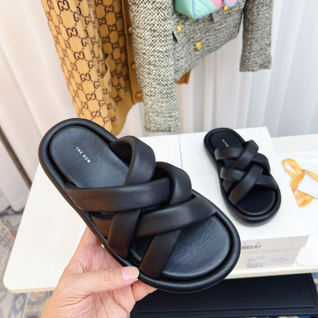 THE ROW 26S CROSSED PADDED SLIDES IN BLACK CALFSKIN