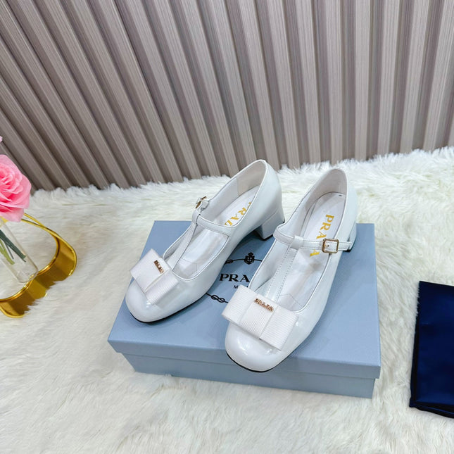 PRADA 26S T-STRAP MARY JANE PUMPS 40MM IN LIGHT BLUE PATENT CALFSKIN WITH BOW