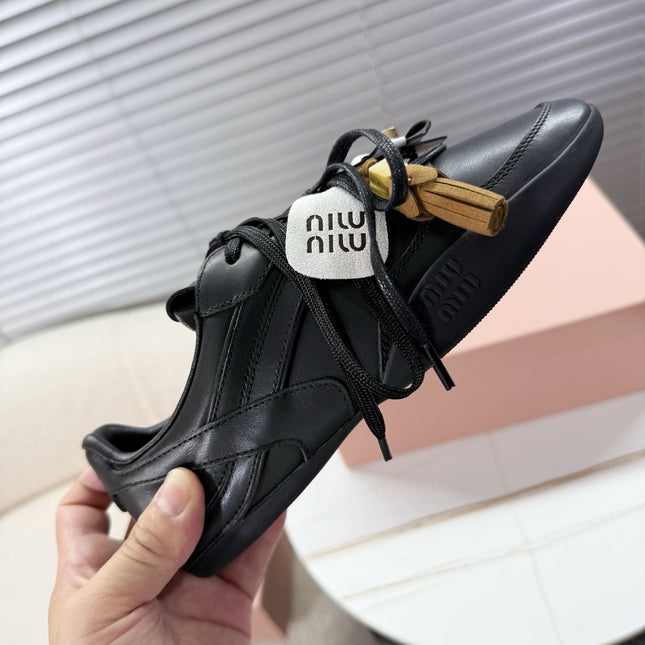 MIUMIU 26S GYMNASIUM SNEAKER IN BLACK CALFSKIN WITH GOLD BUCKLED STRAP