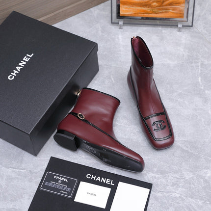 CHANEL 26S ANKLE BOOTS IN BURGUNDY CALFSKIN WITH BLACK PATENT LEATHER TRIM AND CC LOGO ON TOE CAP