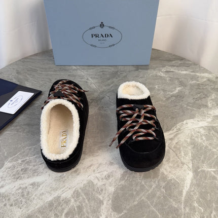 PRADA 26S WOVEN MULES IN BLACK SUEDE