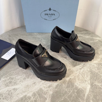 PRADA 26S HEELED LOAFERS 85 MM IN BLACK SMOOTH CALFSKIN