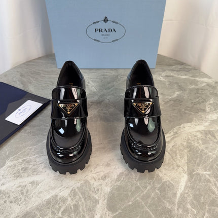 PRADA 26S HEELED LOAFERS 85 MM IN BLACK PATENT CALFSKIN