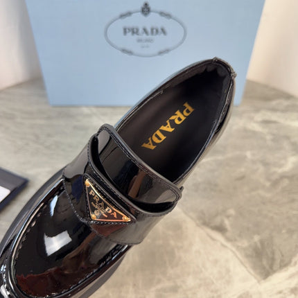 PRADA 26S HEELED LOAFERS 85 MM IN BLACK PATENT CALFSKIN