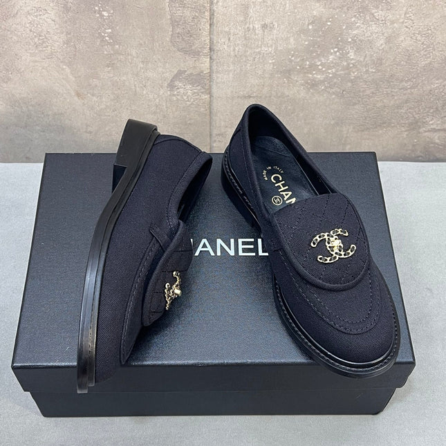 CHANEL 26S LOAFERS IN BLACK CANVAS WITH QUILTED FLAP & CHAIN CC LOGO