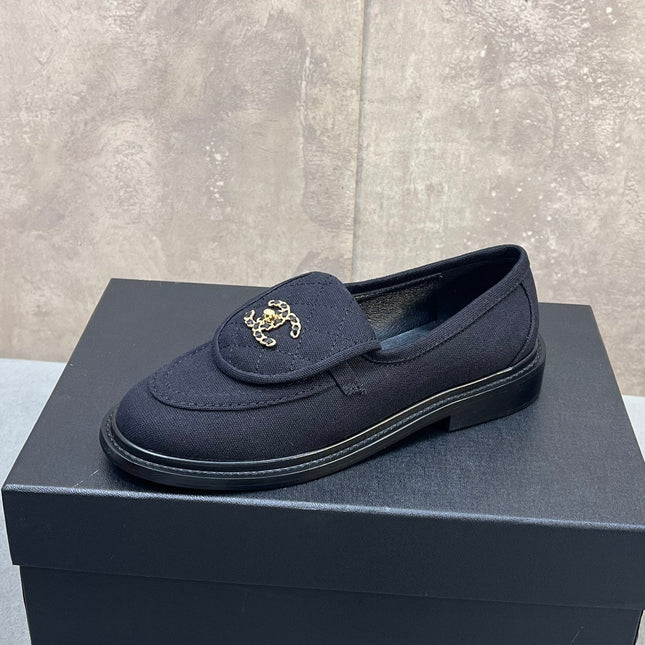 CHANEL 26S LOAFERS IN BLACK CANVAS WITH QUILTED FLAP & CHAIN CC LOGO