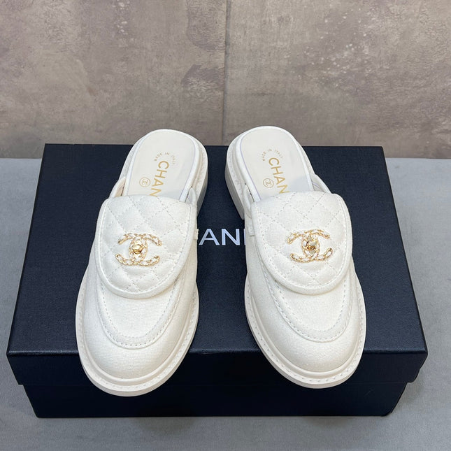 CHANEL 26S MULE LOAFERS IN WHITE CANVAS WITH QUILTED FLAP & CC LOGO