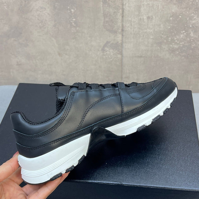 CHANEL 26S RUNNER CC LOGO SNEAKERS IN BLACK CALFSKIN